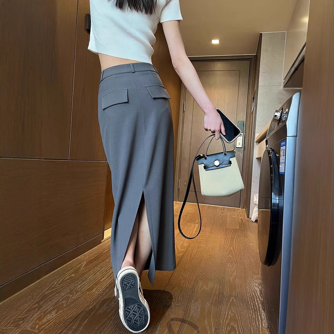 Traje gris falda de media longitud femenina 2025 nueva primavera y otoño cintura alta delgada falda recta temperamento a bolso