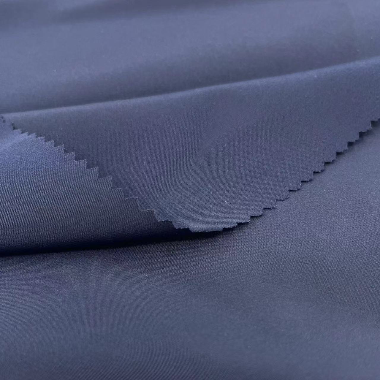 厂家直供75/100涤纶花瑶光华尼2*2户外休闲服面料 全涤防水花瑶