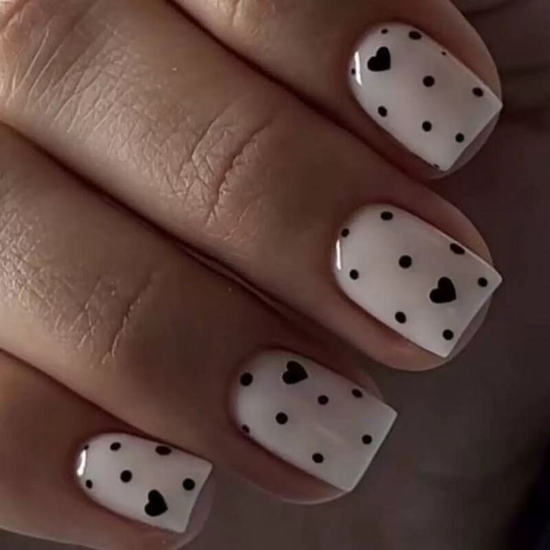 24 Pieces of Short Square Nails with a Milky White Base Color Mixed with Black Small Hearts and Dots, Wearable Nail Art Pieces for Export 24 Pieces of Short Square Nails with a Milky White Base Color Mixed with Black Small Hearts and Dots, Wearable Nail Art Pieces for Export