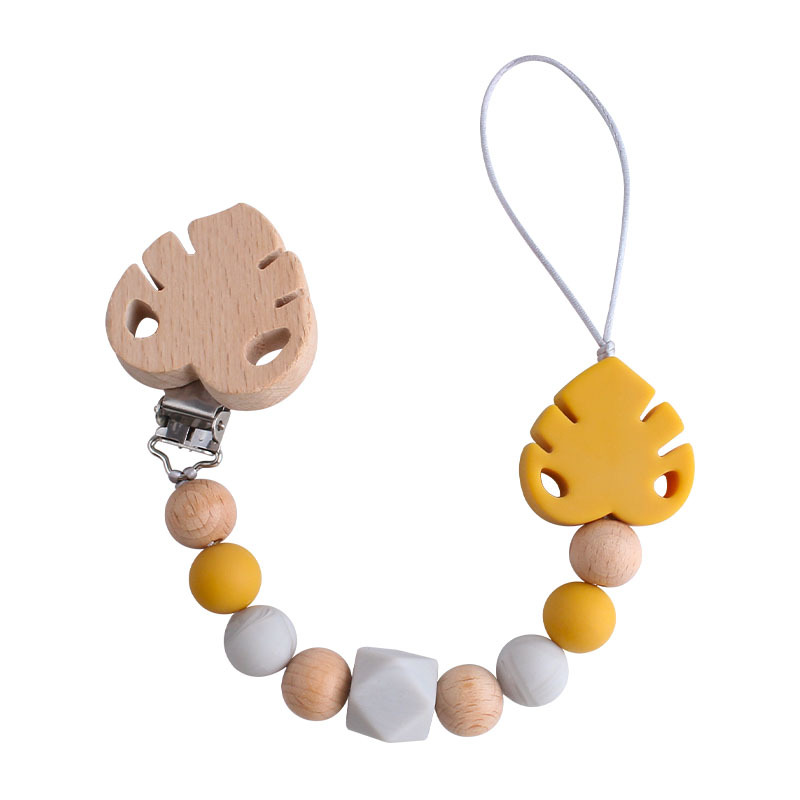 Suministros para bebés creativo clip de chupete de hoja de haya juguete mordedor bebé Cadena de chupete de hoja de silicona cadena anti-caída