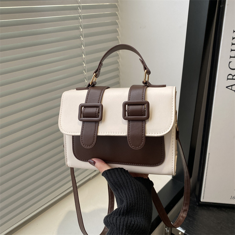 Bolsa de hombro de invierno de color extranjero para mujeres 2024 nueva moda mochila de tela de empalme elegante bolso de mano