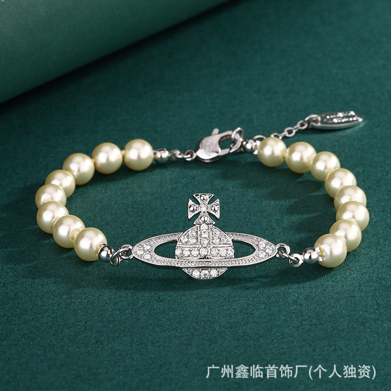 西太后のブレスレットの土星のピンの真珠のブレスレットのクリップのフルダイヤモンドの手の装飾のビビアンの百合の工場は卸売りします。