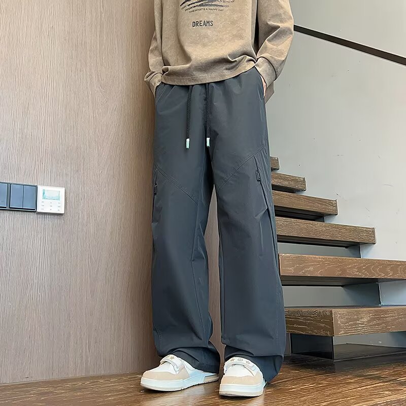 Marca de moda americana de piernas largas sueltas pantalones largos casuales para hombres nuevos pantalones de paracaídas de otoño rectos pantalones de trabajo versátiles