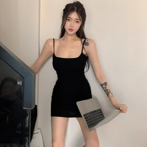 Sexy hot woman's summer casual low-cut strap dress with pure desire to show off curves, trending buttock-grazing dress