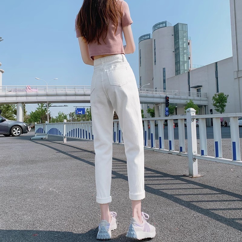 白いハーレムのジーパンの女性の潮流は新型の純色の腰を合わせて簡単にやせているお父さんのダイコンの9分のズボンを現します。|undefined