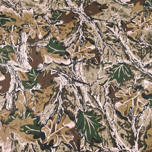 现货迷彩涤纶面料手感适中图案逼真斜纹大树丛林帽子迷彩服装布料