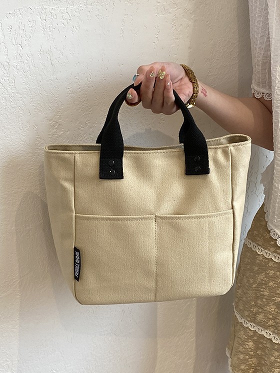 Bolsa de mujer 2026 nuevo bolso de lona de viaje multibolsillo bolso de bolsa de publicidad logotipo impresa en stock