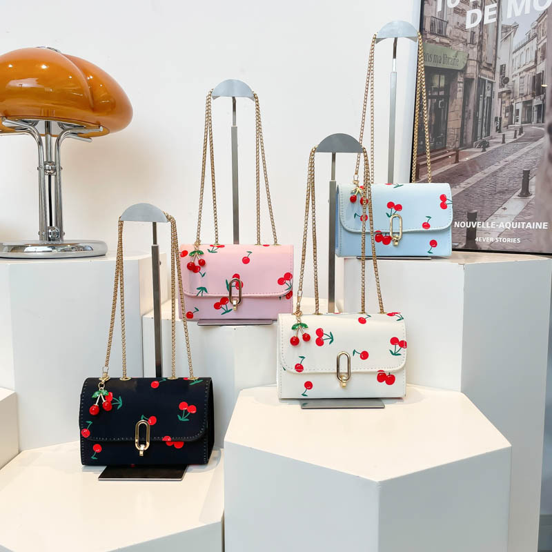 Popularidad transfronteriza pequeña fresca impresión de cereza bolso cuadrado para mujeres 2025 verano nuevo bolso de hombro universal mochila