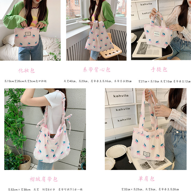 25247 embossed Cherry large-capacity portable bag, hand-held bag, storage bag, ladies' tote bag, single-shoulder pull-out shoulder strap details Picture