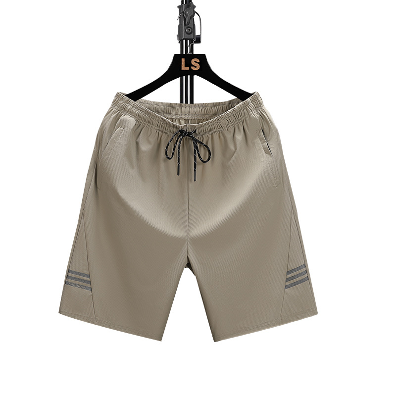 Pantalones cortos casuales para hombres en verano 2024 nueva versión coreana de la tendencia tubo recto relajado y ligero INS cinco división del trabajo pantalones de playa