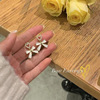 Metal accessory, small design earrings from pearl with bow, Japanese and Korean, simple and elegant design, trend of season