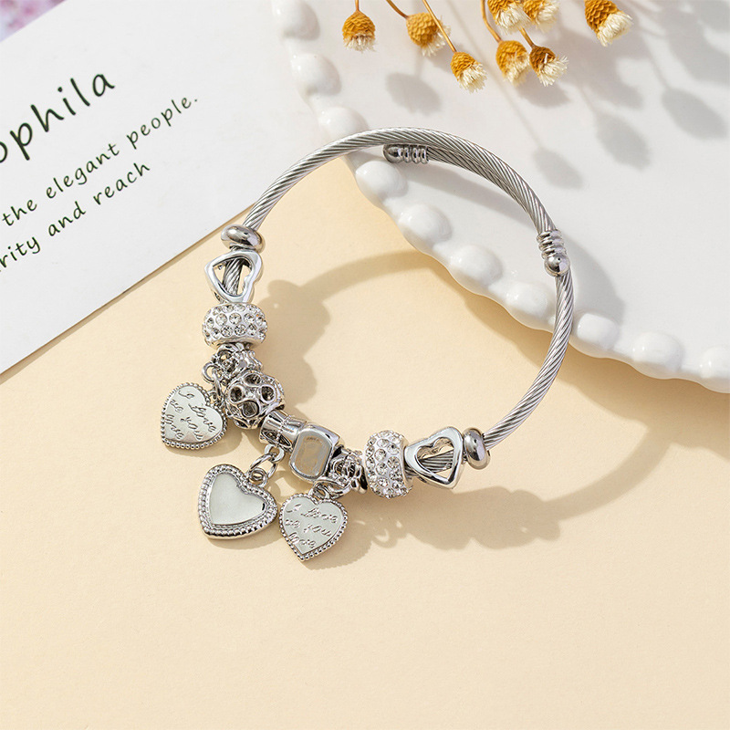 Panjia pulsera Dora DIY cuentas explosivas transfronterizas anillo de acero inoxidable bola de perforación aleación de letra en forma de corazón brazalete accesorios
