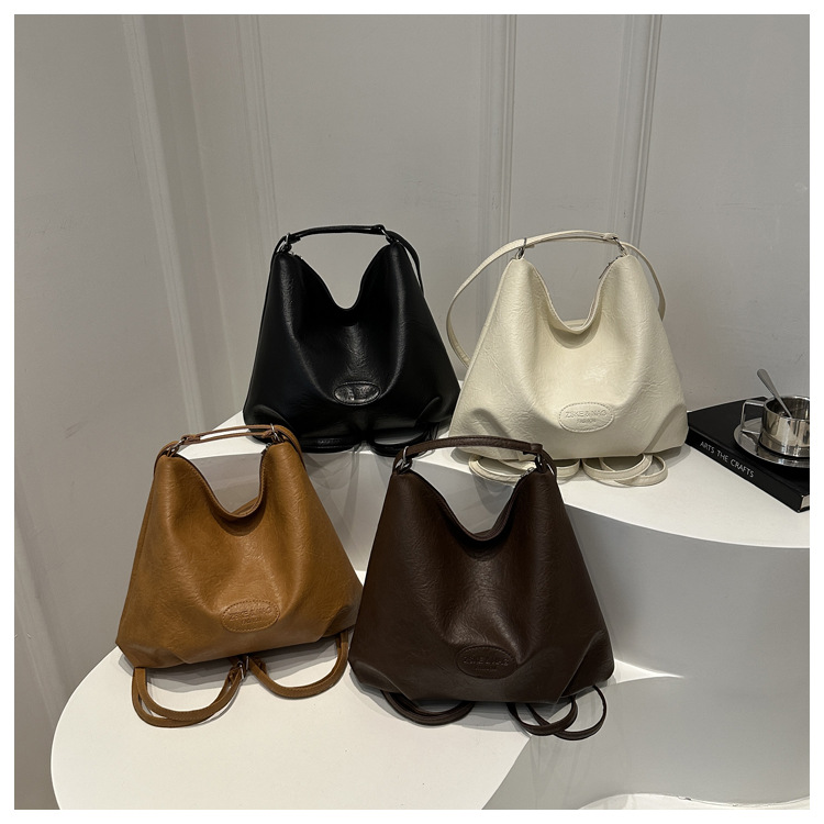 The 2024 new pleated tote bag is a large-capacity casual and fashionable backpack for women, featuring multi-functional texture and a single-shoulder crossbody bag undefined