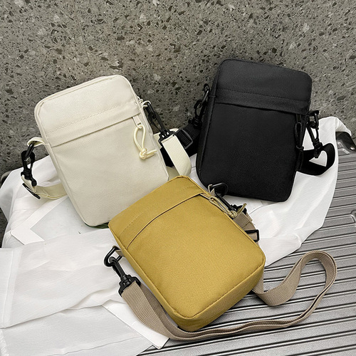 Oxford cloth casual crossbody bag for boys new Japanese style ins simple solid color versatile mobile phone bag women's street backpack