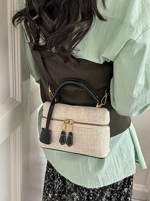 Bolso de mano de alta sensación para mujeres 2026 nuevo nicho zhong lino bolsa de almuerzo de viaje transfronterizo mochila pequeña bolsa