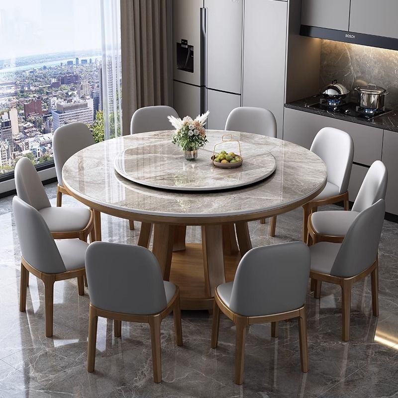 Mesa de comedor de tabla de roca de lujo ligera, mesa redonda de madera maciza doméstica con mesa giratoria, mesa de comedor redonda de alta gama con horno electromagnético rojo.