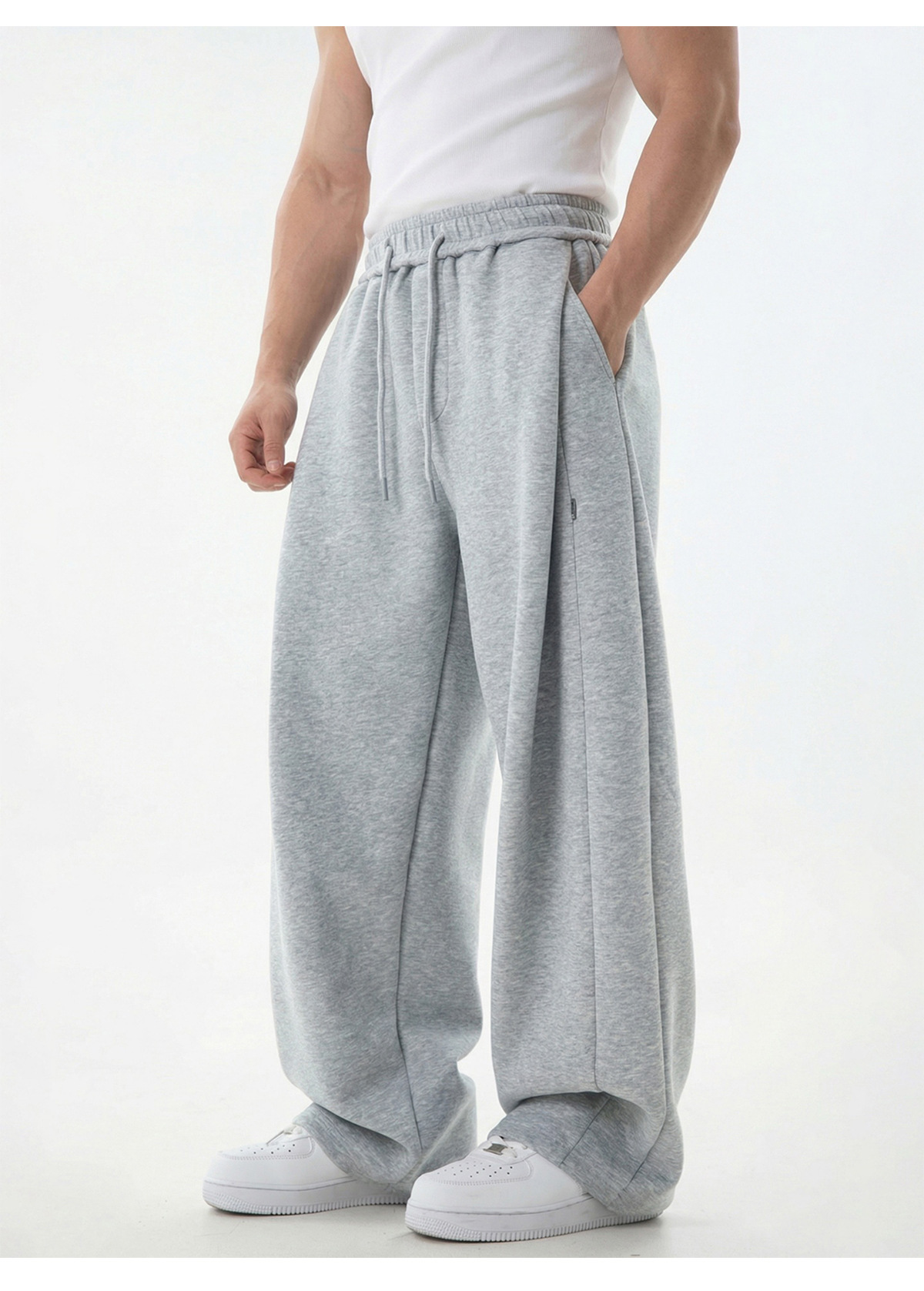 Pantalon de jogging pour homme à empiècements texturés, coutures asymétriques modernes, entrejambe basse, coupe décontractée, tombé impeccable._voghion.com