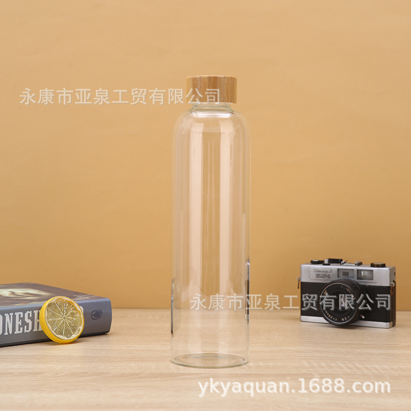 Fabricantes de suministro de copas de bambú portátiles de vidrio transparente aislamiento térmico taza de agua de oficina acompañante taza de regalo se puede imprimir logotipo