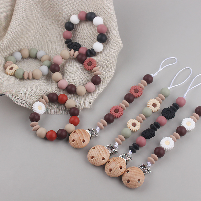 Nueva margarita pequeña cadena de tetina para calmar a los bebés anti-caída cadena creativa DIY pulsera de goma de diente dos conjuntos