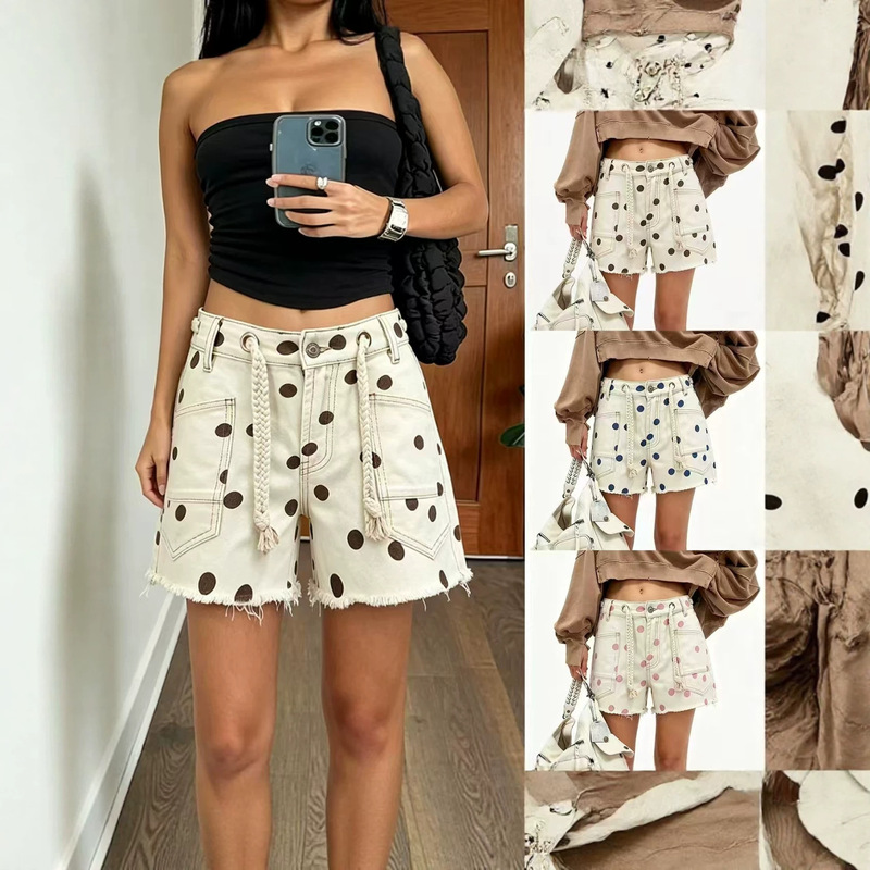European and American style off-white and pink polka dot denim shorts, high-waisted with woven drawstring, frayed edges, utility pockets, slimming and trendy for hot girls