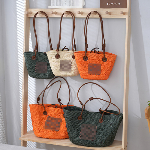 The new straw bag from Luo's, crossbody tote with single shoulder strap, large capacity woven bag, perfect for beach vacation and sandy shores.
