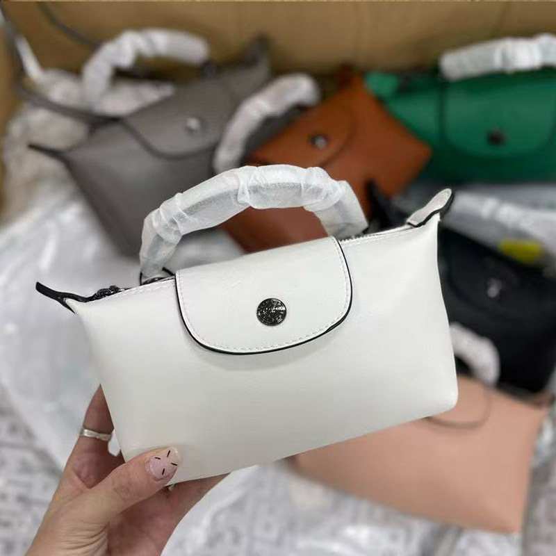 フランスの新しいスタイルのショートハンドルミニラムスキン餃子バッグ多用途ファッショナブルなワンショルダークロスボディクラッチバッグミニ携帯電話バッグ|undefined
