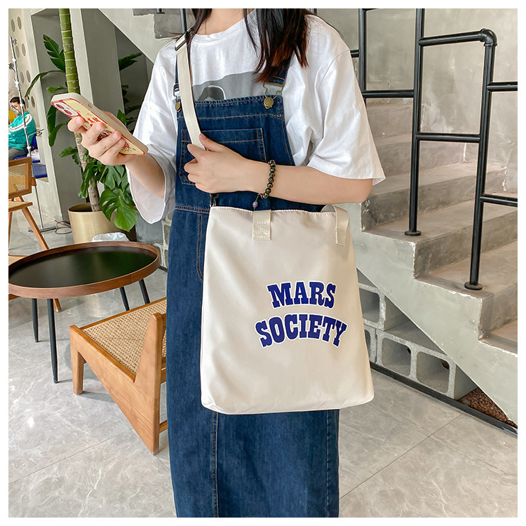 Canvas bag for women, single shoulder, ins crossbody, laid-back style, college student class bag, artistic Japanese style, large capacity, Hong Kong style, chic undefined