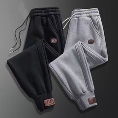 秋の新型カジュアルパンツのゆるいスポーツパンツのウエストパンツのトレンドは、ハーレムパンツの足の男性の秋のズボンに合わせています