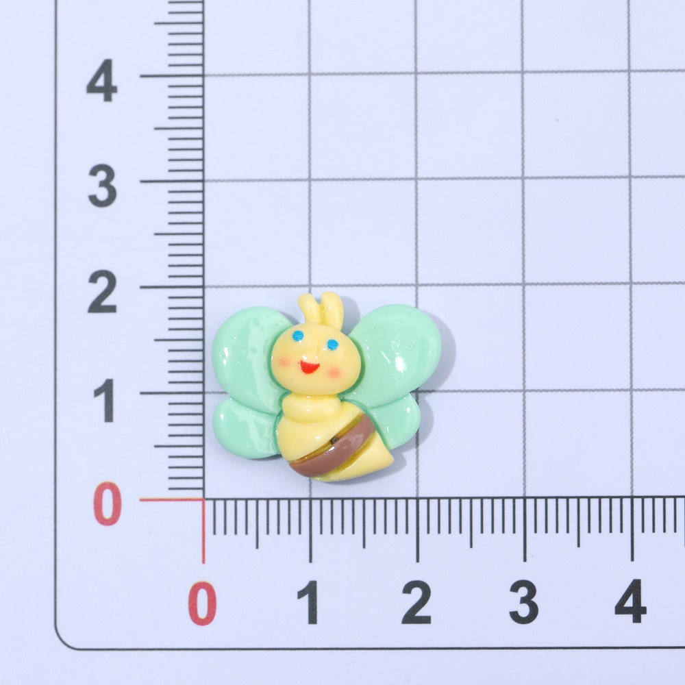 Macaron color pastoral abeja mariposa resina accesorios DIY crema pegamento accesorios para el cabello teléfono móvil Shell accesorios hechos a mano al por mayor