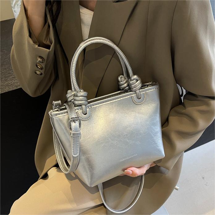 Moda nicho bolso de cubo de mano para mujeres 2024 nuevo estilo coreano simple bolso de hombro de diseño de alto nivel bolso de mochila