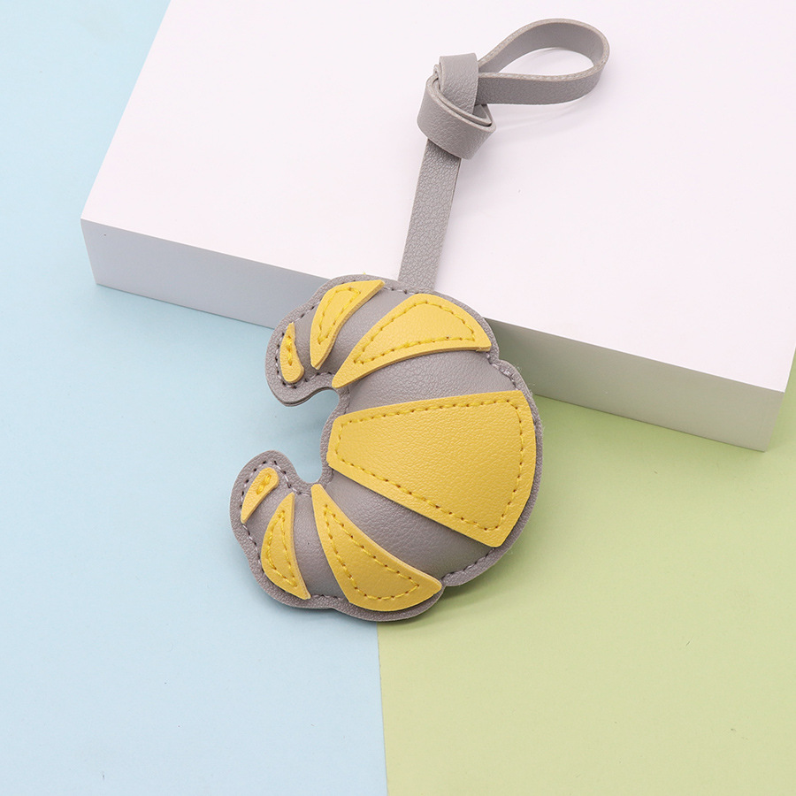 Moda y creatividad cuero de imitación hecho a mano bolso de cuerno hebilla colgante colgante bolso hecho a mano colgante fábrica al por mayor