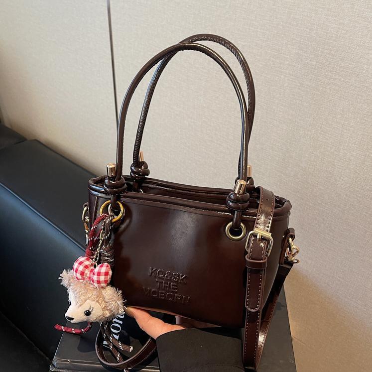 Bolsa de cubo retro explosiva para mujeres 2025 nuevo bolso de nicho de diseño de alta humedad versátil bolso de hombro