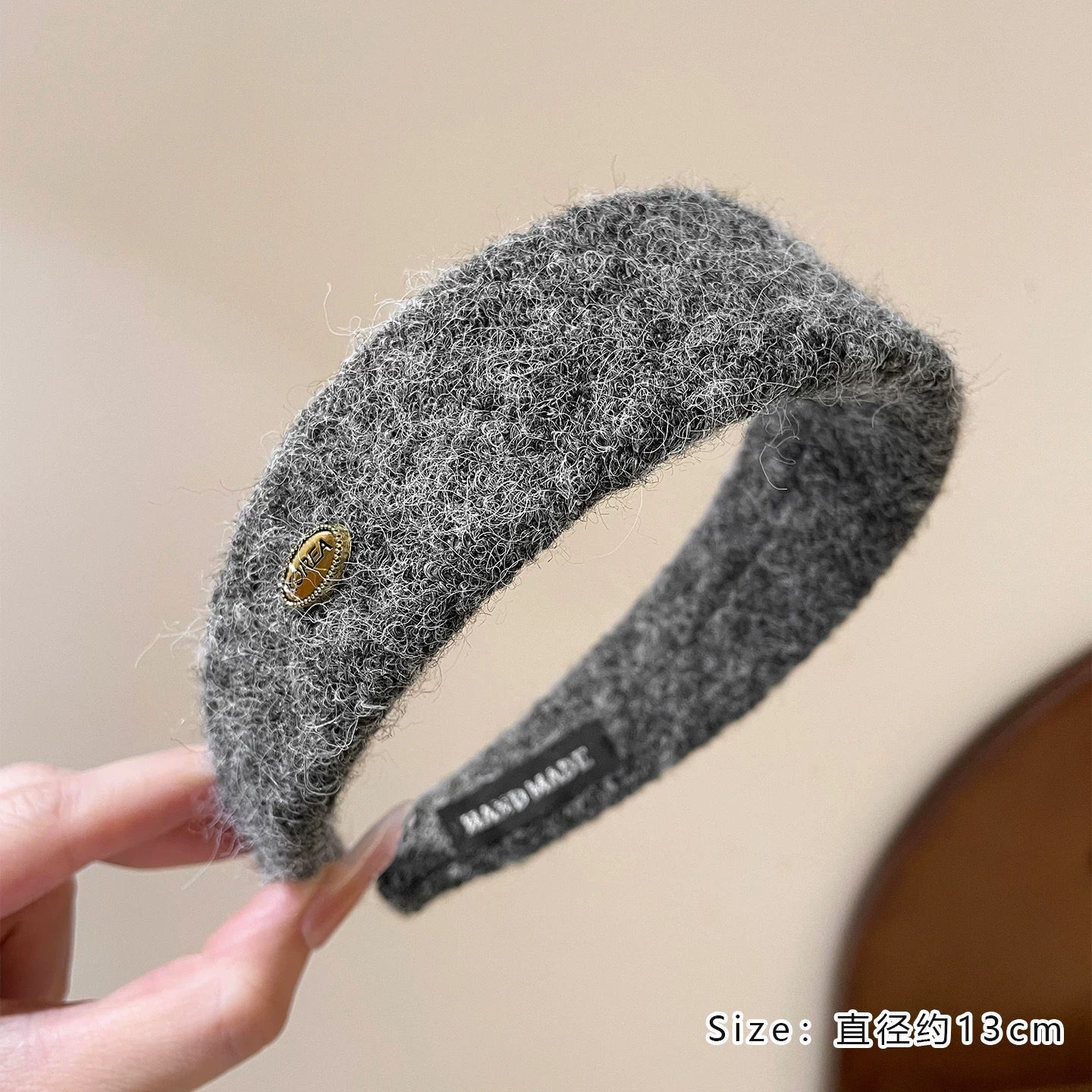 #210 gray woolen oval gold label headband