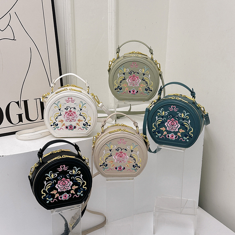 Bolsos bordados de alta calidad bolsos de mujer 2024 nueva moda de verano bolsos redondos portátiles bolsos de hombro versátiles