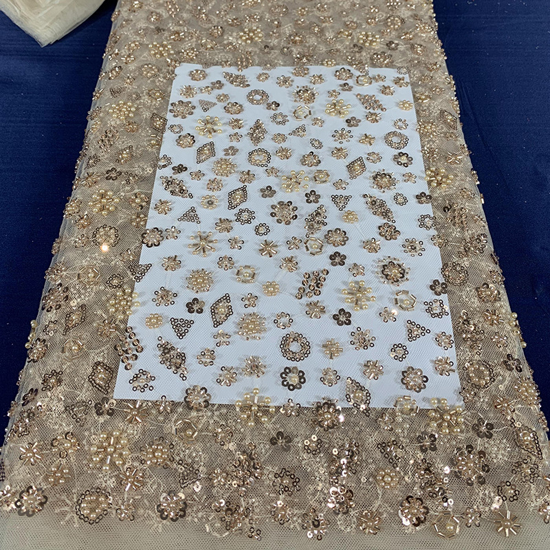 Tejido de bordado de tubo de perlas de lenteja tejido de bordado de malla láser tridimensional tejido de moda de vestido europeo y americano Gaoding