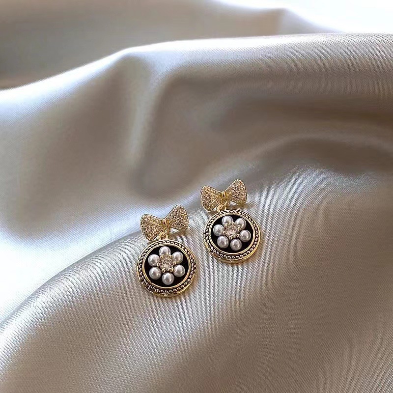 @Oferta especial @ Joyería elegante pendientes simples con lazo de perlas pendientes de moda versátiles de alta gama para mujer pendientes al por mayor