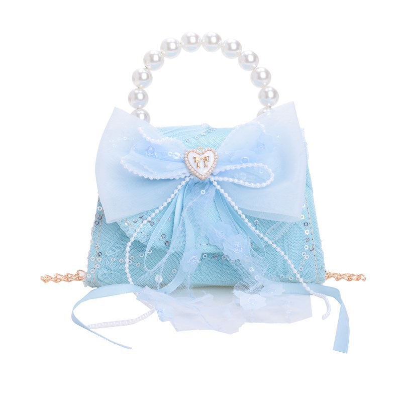 Nuevo bolso de moda para niños bolso de perla animado lindo arco de botón bolso de hombro de niñas cadena diagonal bolso pequeño
