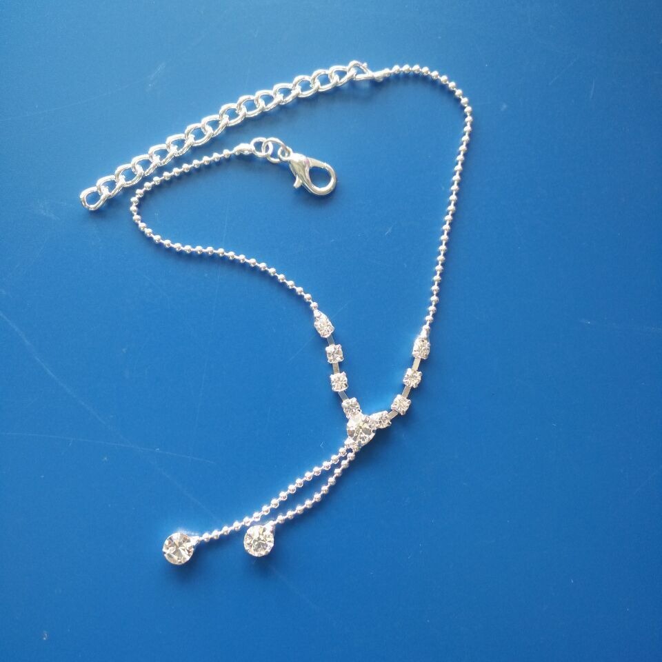 Catena corpo con nappe in strass a goccia per donna in argento_voghion.com