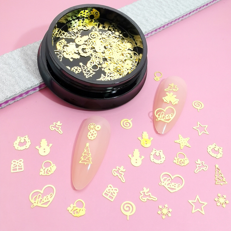 Cross-border new Christmas-themed alloy nail art decorations, featuring metal hollowed-out snowflake and reindeer nail stickers with embossed rhinestones