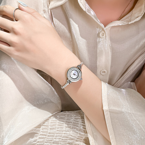 Light luxury women's watch SKHL time and space corridor rhinestone women's fashion shell surface temperament quicksand dial niche bracelet watch