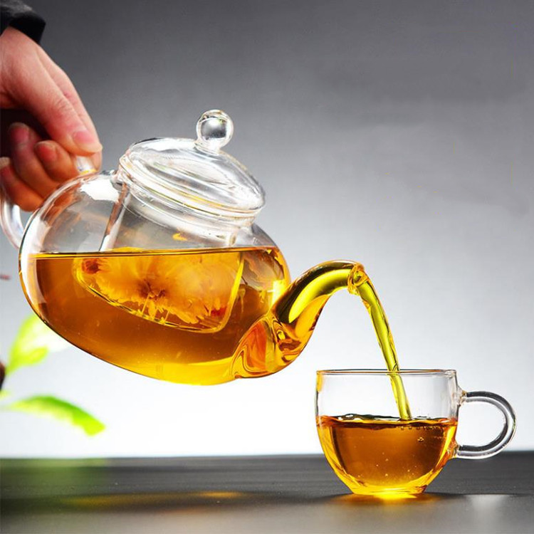 Los fabricantes suministran cuatro estaciones tetera de vidrio borosilicato tetera transparente Kung Fu juego de té traje