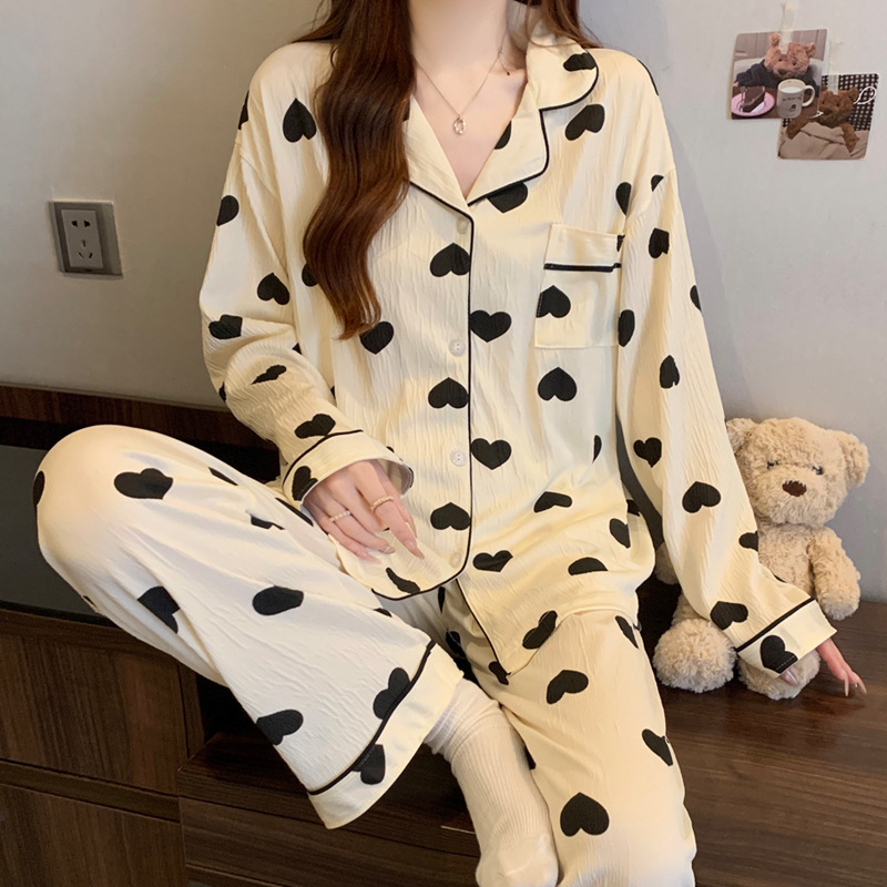 蝶結びのさくらんぼのプリントの女性のパジャマの春と秋の新型のカーディガンの長袖のズボンの部屋の服のスーツは実際に卸売りをたたきます。|undefined