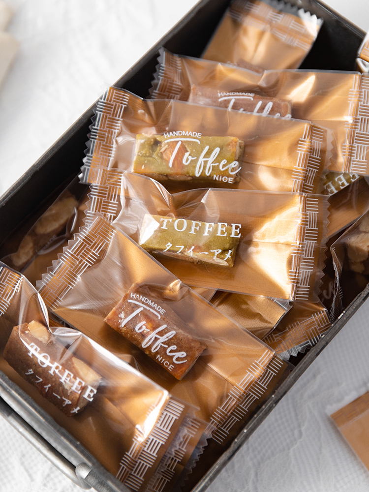 Bolsa de toffee de almendras de sal de mar gruesa independiente Tauragnut único caramelo de café sellado de máquina Año Nuevo 2025