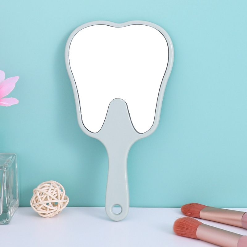 Espejo portátil en forma de diente pequeño clínico dental HD espejo de mano multicolor publicitario