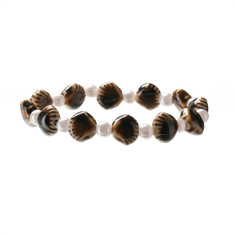 Creativo nuevo estilo de cerámica concha de sandía cuentas de color pulsera de cuentas redondas perla de imitación pulsera de cuentas de cerámica spot al por mayor