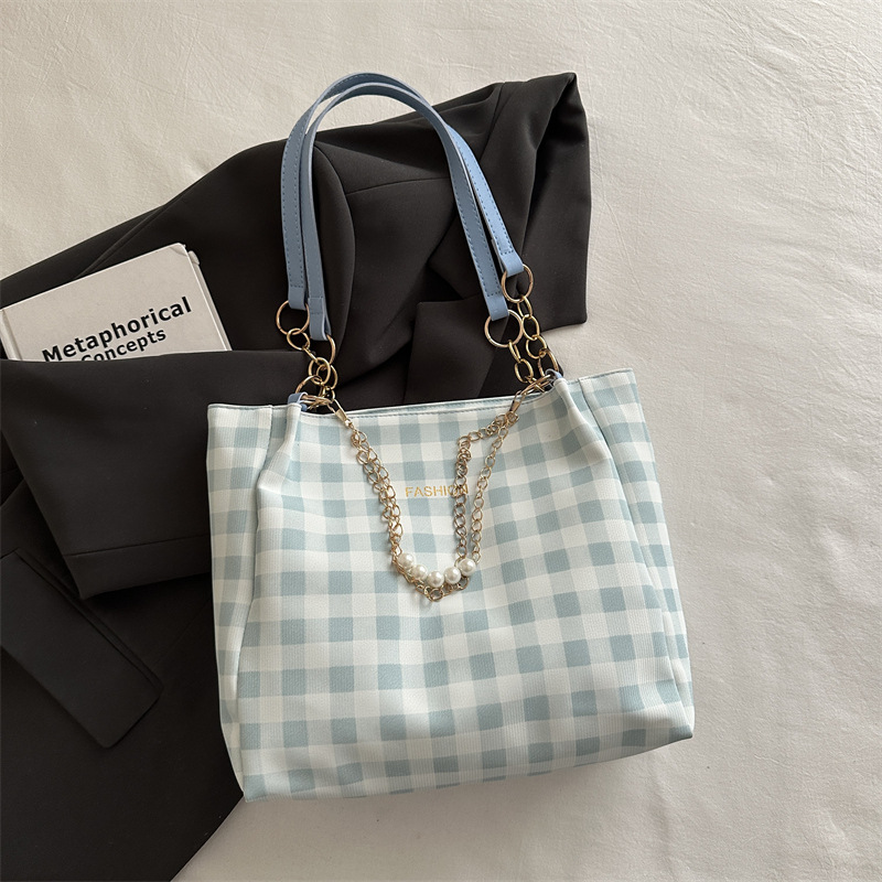 Bolsa de alto valor reticular para mujeres 2026 primavera y verano nuevo paquete de viaje de hombro universal bolso de nicho en línea bolsa de mujer