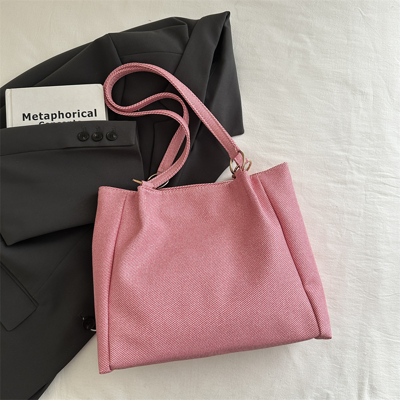 Bolsa de textura para mujeres de gran capacidad 2025 nueva primavera y verano ocio rayas bolsas de compras de hombro para clase de viaje bolsa
