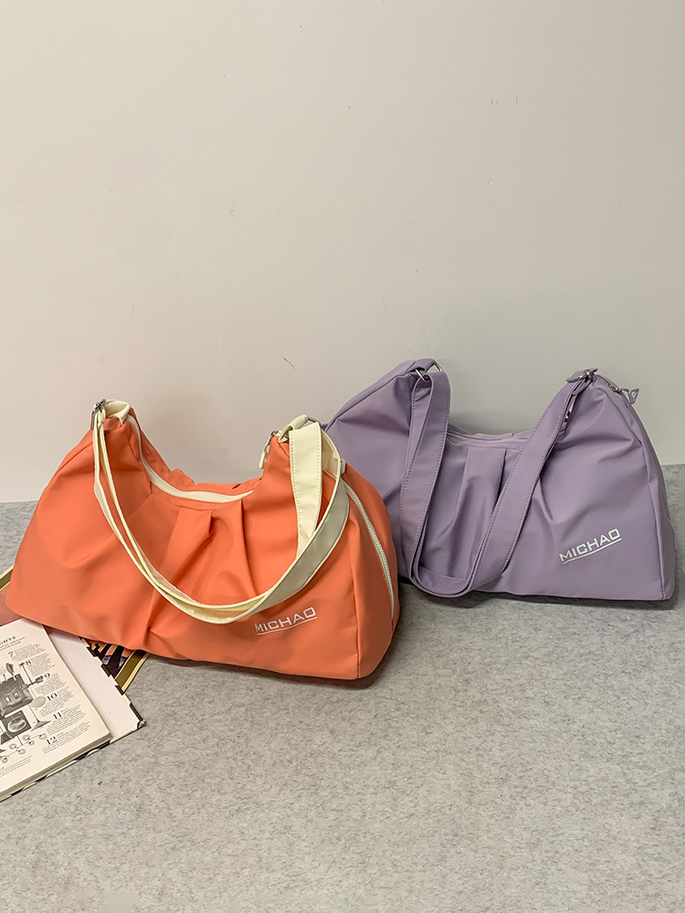 2025 nueva bolsa de equipaje para mujeres bolsa de excursión bolsa deportiva de gran capacidad bolsa de ejercicios bolsa de hombro ligera bolsa al por mayor