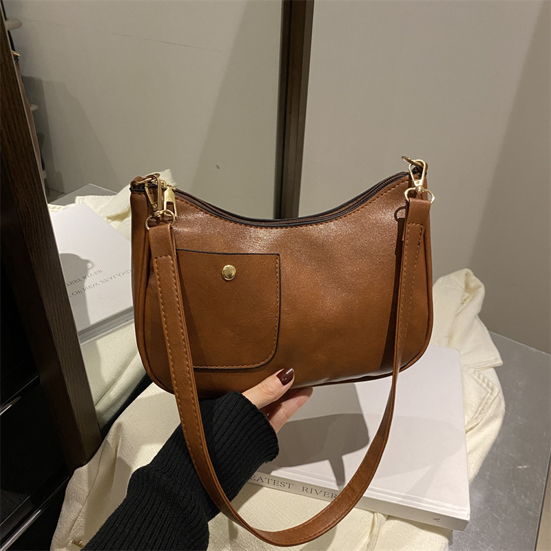 Bolso de mujer retro coreano personalidad 2025 bolso de media luna de hombro de estilo nuevo estilo francés bolso de diseño de nicho bajo la axila
