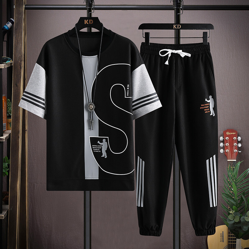 Una pieza de generación de cabello traje de moda de estilo caliente de verano para hombres, camiseta de manga corta de tendencia para hombres, pantalones casuales, traje de dos piezas